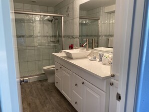 Shower, hair dryer, towels, soap