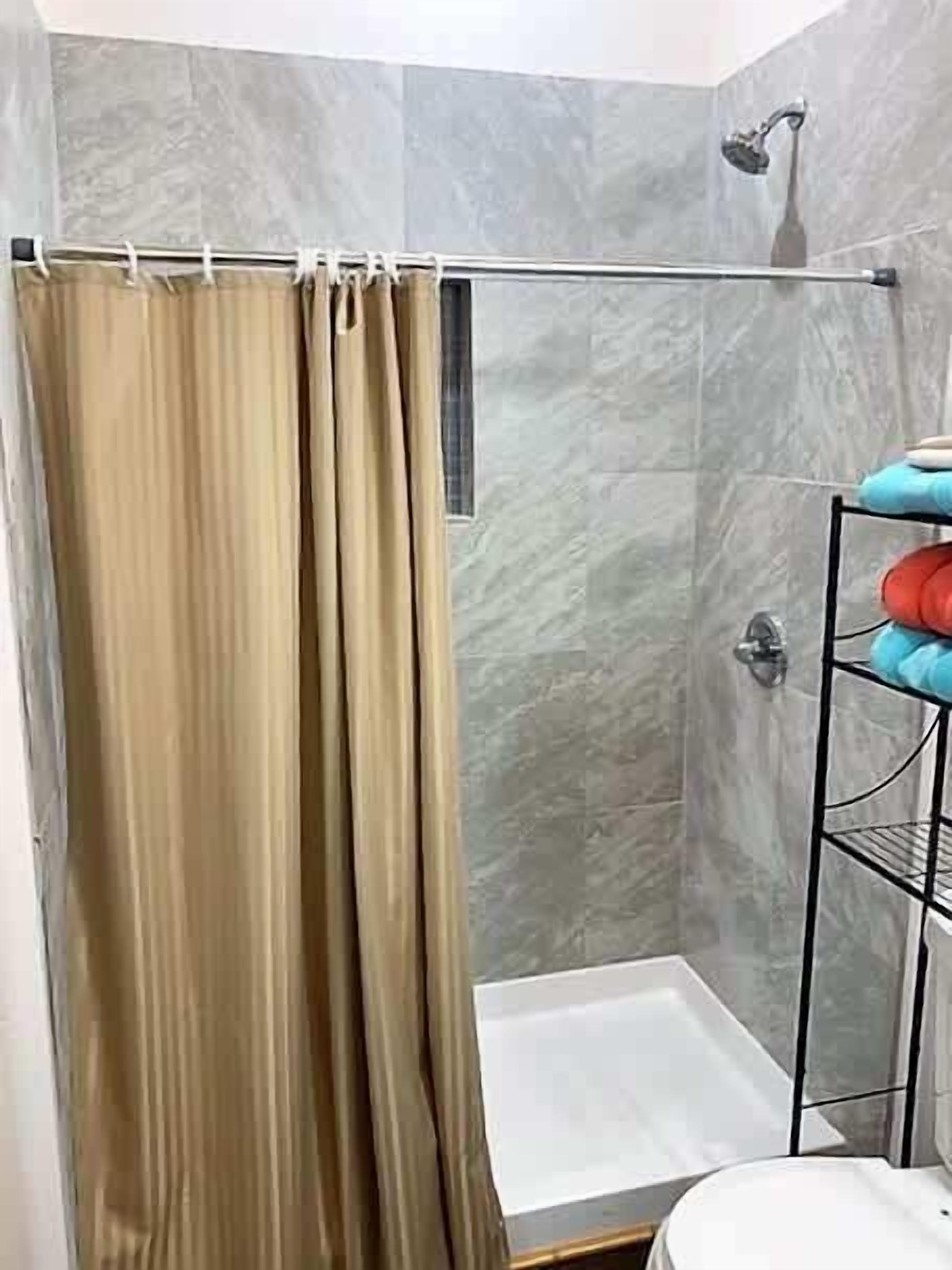 Shower, towels, soap, toilet paper