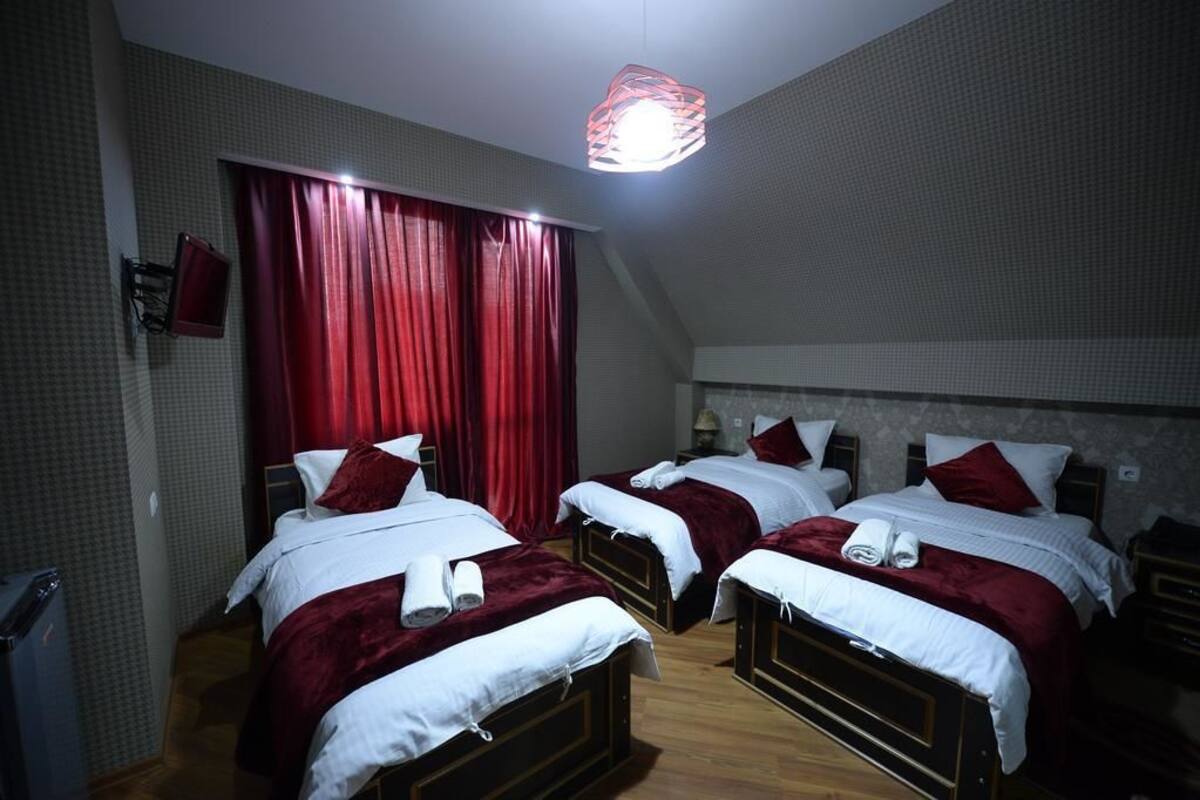 Standard Triple Room | Desk, blackout drapes, free cribs/infant beds, free WiFi