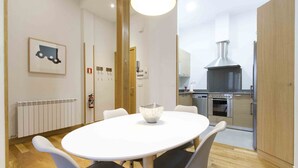 A modern kitchen with stainless steel appliances, a large stove, and a built-in oven. - Dream | The Rentals Collection (San Sebastián/Donostia)
