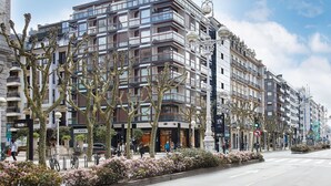 A multi-story building with a modern architectural design, featuring balconies and large windows. - Hondarribia | The Rentals Collection (San Sebastián/Donostia)