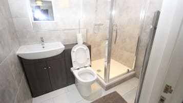 Combined shower/tub, hair dryer, towels, soap