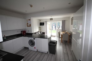 Enjoy a compact yet functional stay with a kitchen, dining area, and cozy seating space.