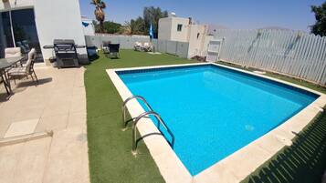 Seasonal outdoor pool, pool umbrellas, sun loungers