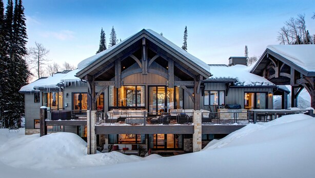 A large, multi-story lodge with a prominent entrance and a covered outdoor seating area. - Ski-in/out Luxury Mansion, Game & Theater Rooms, Private Hot Tubs! Park City Colony Grand (Park City)