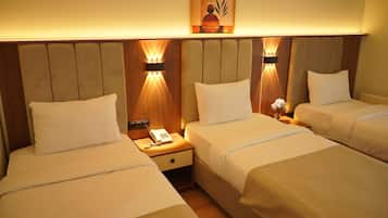 Standard Triple Room | Minibar, desk, laptop workspace, soundproofing