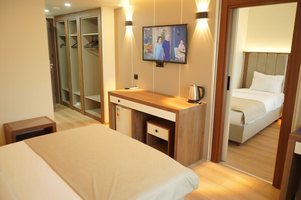 Family Room, Connecting Rooms | Minibar, desk, laptop workspace, soundproofing - Lion City Hotel (Bursa)