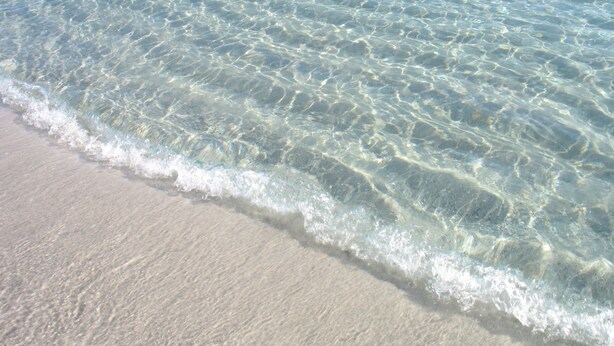 A beach with clear shallow water and a sandy shore. - House 100 meters from the sea Sardinia (SINISCOLA)