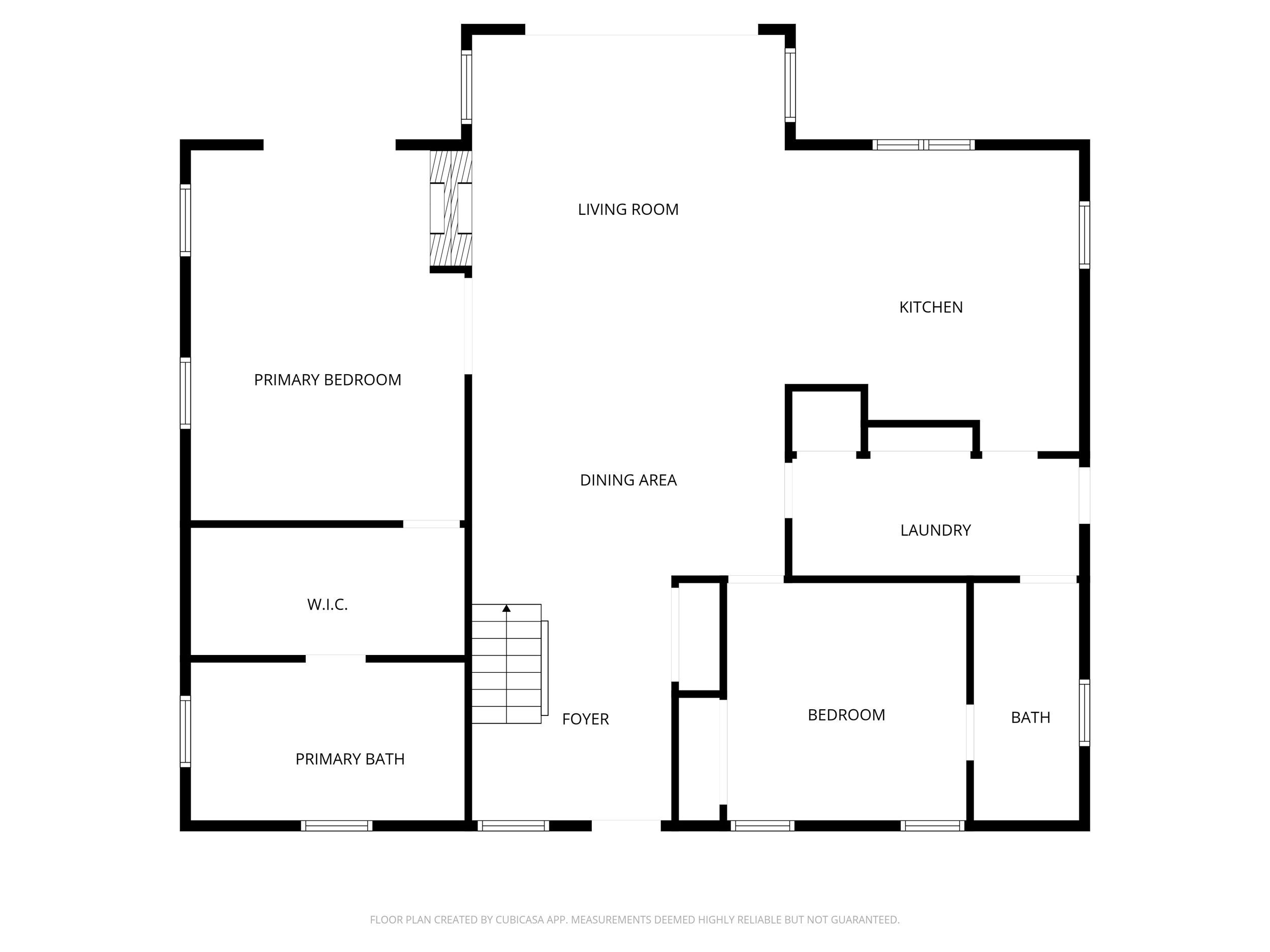 A floor plan with a primary bedroom, living room, dining area, kitchen, laundry, foyer, and bathroom.