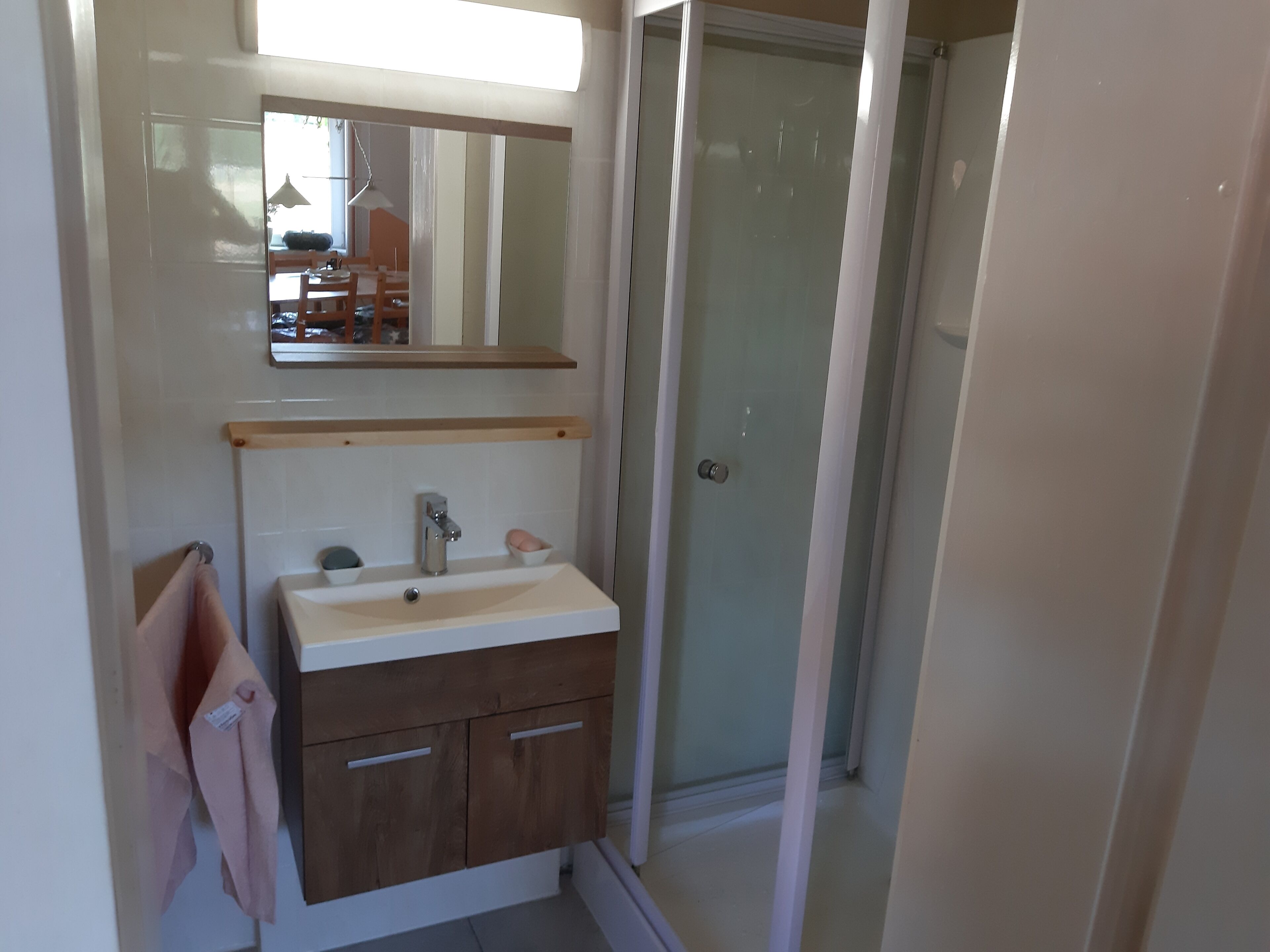 Shower, hair dryer, soap, toilet paper