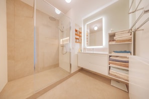 Combined shower/tub, hair dryer, towels, soap