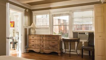 1 bedroom, desk, iron/ironing board, travel crib