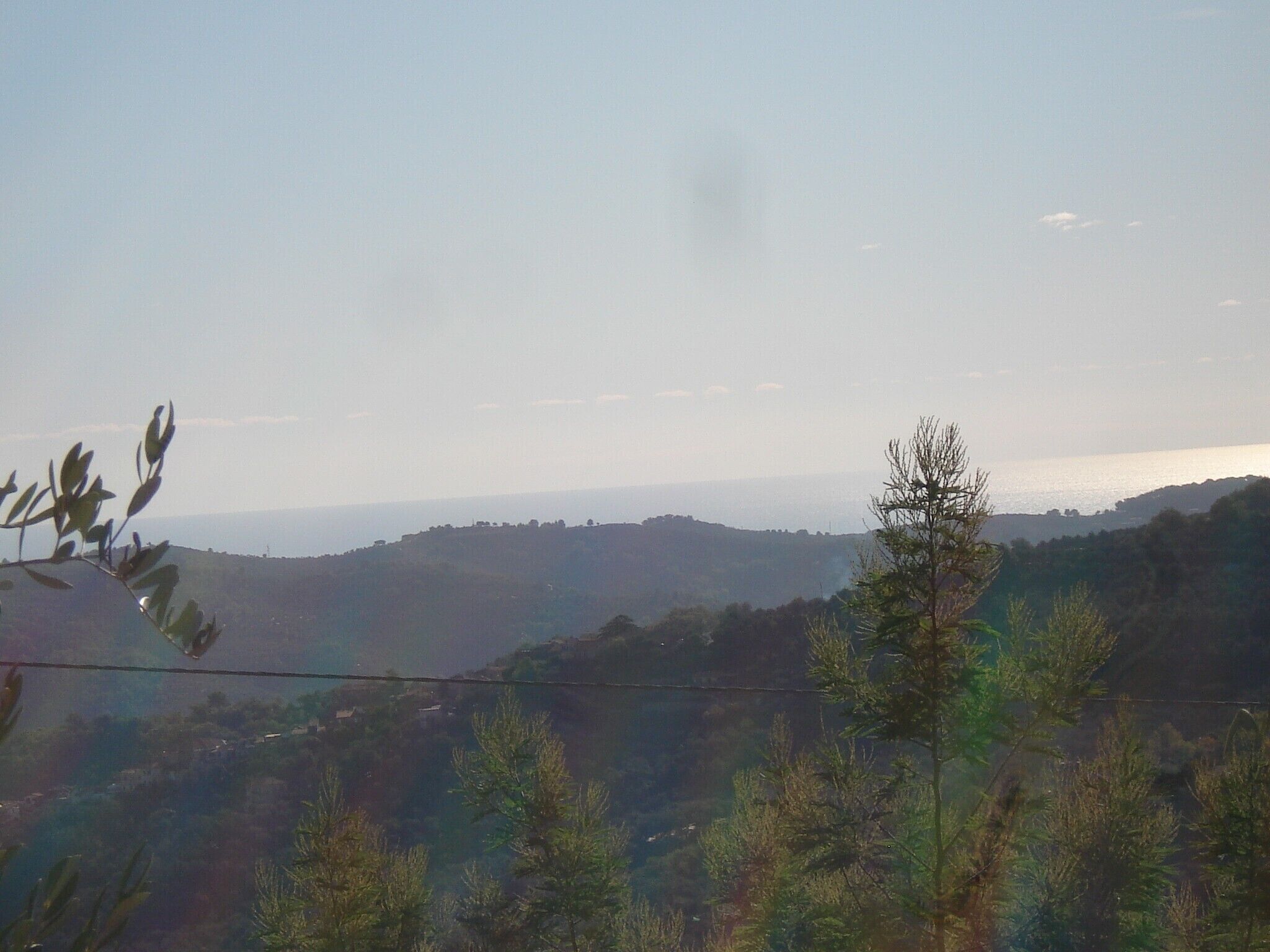 A view of a hilly landscape with a clear sky.