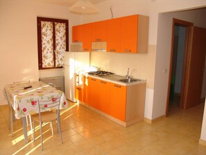 Fridge, stovetop, dining tables