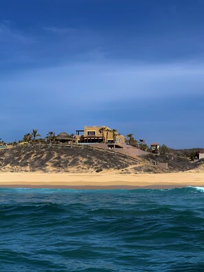 On the beach, sun-loungers, beach towels