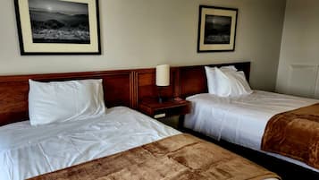 Premium bedding, memory-foam beds, desk, laptop workspace