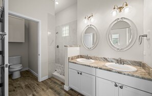 Shower, hair dryer, towels, shampoo