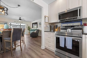 Coffee/tea maker, fridge, microwave, oven