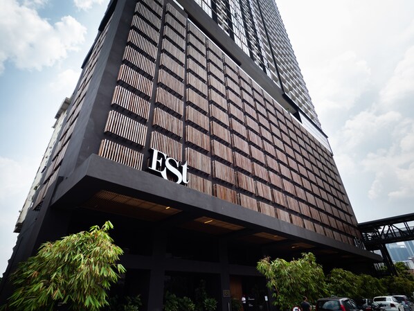 A tall building with a modern facade, featuring a prominent 'EST' logo on the lower part. - The Establishment at Bangsar KL Sentral (Kuala Lumpur)