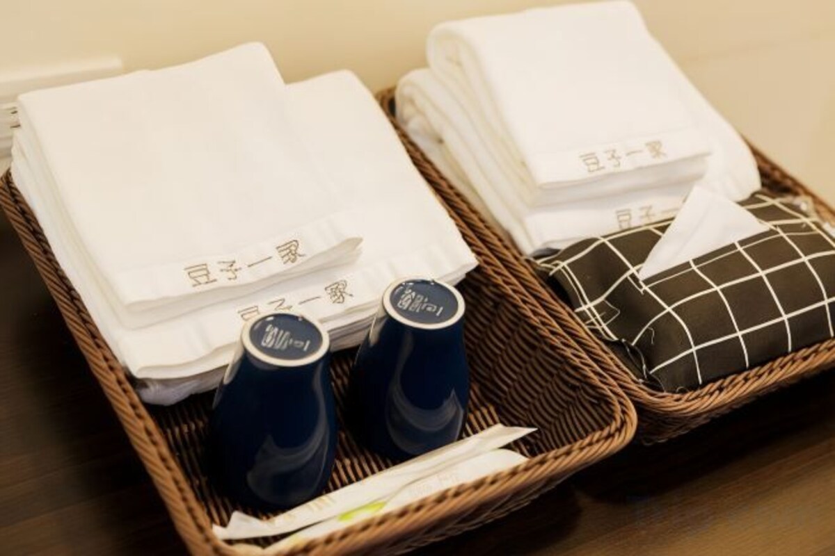 Bathroom amenities | Shower, hair dryer, slippers, towels