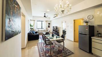 Comfort Apartment, 3 Bedrooms, Non Smoking, City View | Living area | 40-inch Smart TV with cable channels, TV