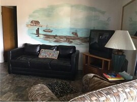 Family Suite | Living area | 32-inch LED TV with cable channels, TV, pay movies