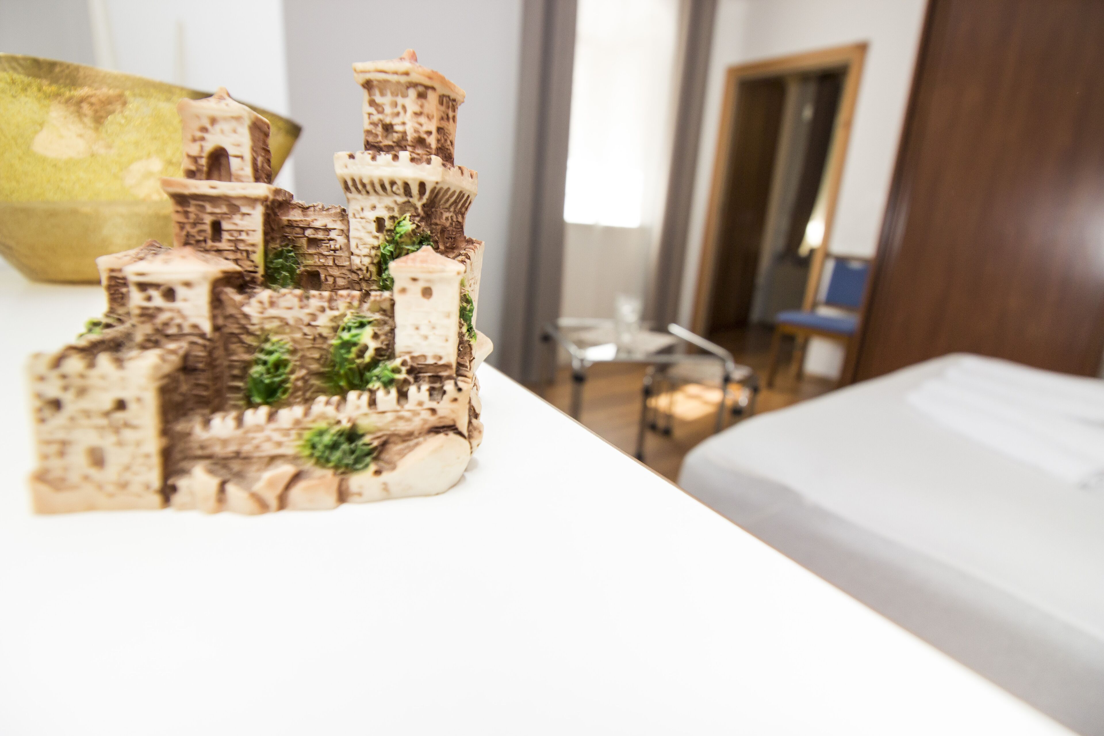 A model castle on a table in a hotel room.