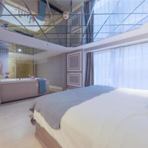 A modern hotel room with a large bed, a built-in desk, and a large window. - Floral Hotel Chongqing Meila (Chongqing)