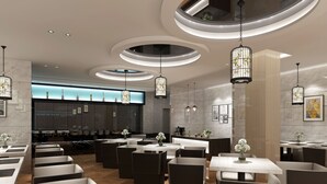 A modern restaurant with a central bar area, multiple dining tables, and contemporary lighting fixtures. - Metropolo  Liyang Pingling West Road Hotel (Changzhou)