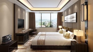 A modern hotel room with a large bed, a desk, a TV, and a view of the city. - Metropolo  Liyang Pingling West Road Hotel (Changzhou)