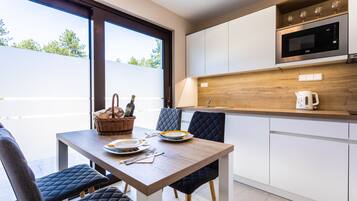 Apartment, 1 Queen Bed with Sofa bed | Private kitchen | Full-sized fridge, microwave, stovetop, dishwasher