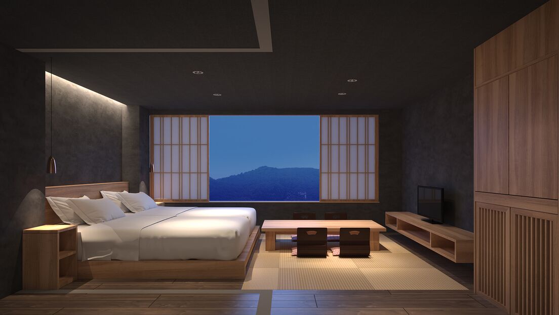 Ein modernes Schlafzimmer mit einem großen Bett, einem Fernseher und Blick auf Berge durch ein Fenster.