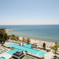 Indoor pool, outdoor pool, pool umbrellas, pool loungers