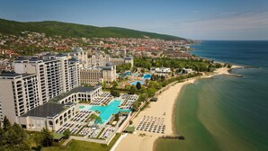 A coastal hotel with multiple buildings, a large swimming pool, and a beach. - Secrets Sunny Beach Resort & Spa - All Inclusive - Adults Only (Sunny Beach)