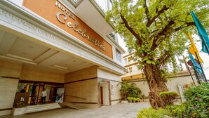 A hotel entrance with a sign reading "Hotel Celebration." - Hotel Celebration - Raipur (Raipur)