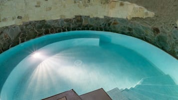 Indoor pool, open 9:30 AM to 7:00 PM, pool loungers
