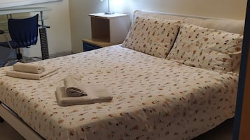 1 bedroom, desk, iron/ironing board, travel crib