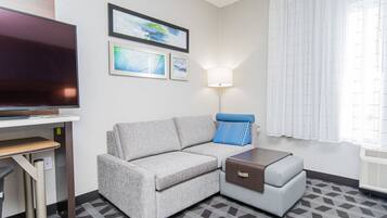 Tabla de planchar con plancha, wifi gratis y ropa de cama