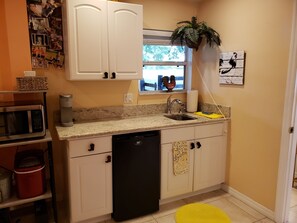 Fridge, microwave, stovetop, coffee/tea maker