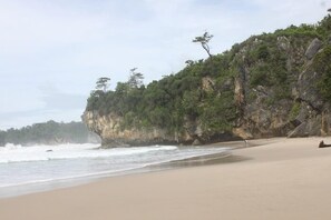On the beach, sun-loungers, beach towels