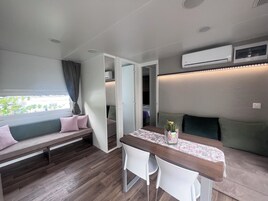 Mobile Home Premium | Living area | Flat-screen TV