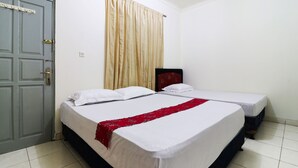 A hotel room with two beds, a grey door, and a curtain. - Wisma Lamida 2 Syariah (Jakarta)