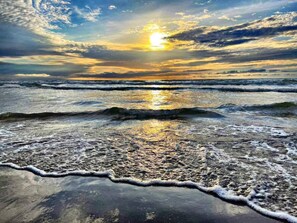 A beach with waves and a sunset. - Coco Beach Hotel on South Padre Island (South Padre Island)
