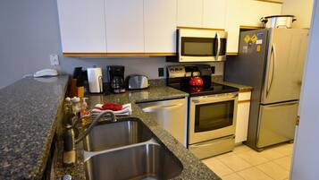 Condo (MH201) | Private kitchen | Full-size fridge, microwave, oven, toaster