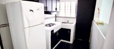 Design Apartment, Multiple Beds, Non Smoking | Private kitchen | Full-sized fridge, microwave, oven, stovetop