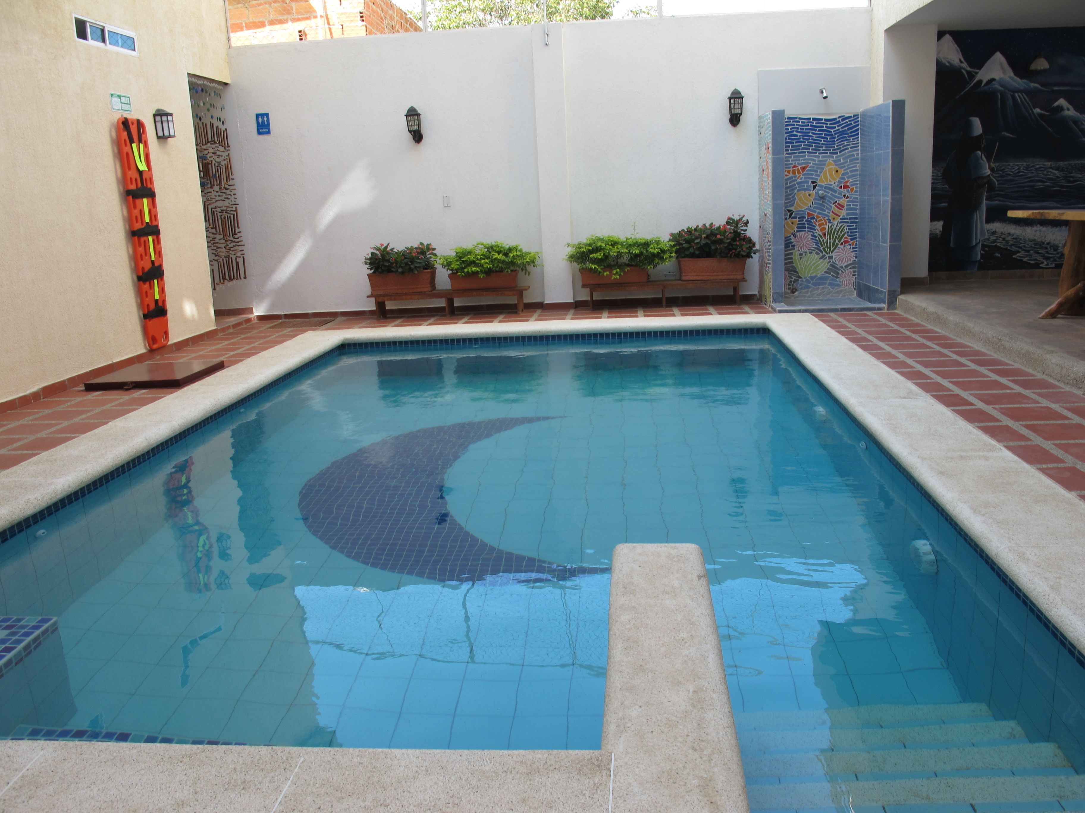 Outdoor pool, open 8:00 AM to 10:00 PM, pool loungers