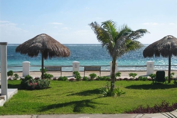 View of ocean and patio/pool area