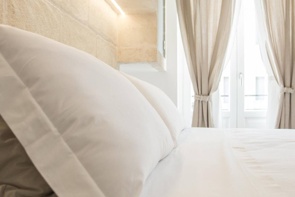 Premium bedding, down duvets, blackout curtains, soundproofing