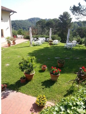Relax in a serene outdoor space with comfortable seating and lush surroundings.