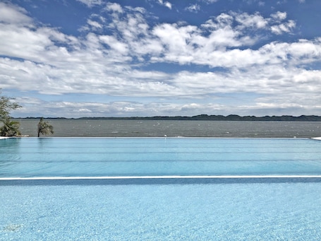 3 outdoor pools, open 8:00 AM to 10:00 PM, pool loungers. Sea Garden Resort Iloilo